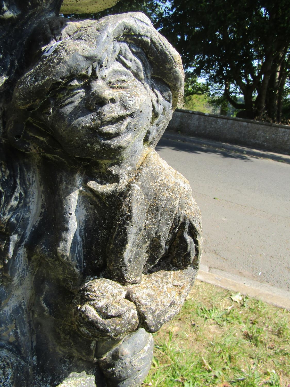 A weathered cast composition stone two sectional bird bath, the pedestal in the form of a man beside - Image 2 of 4