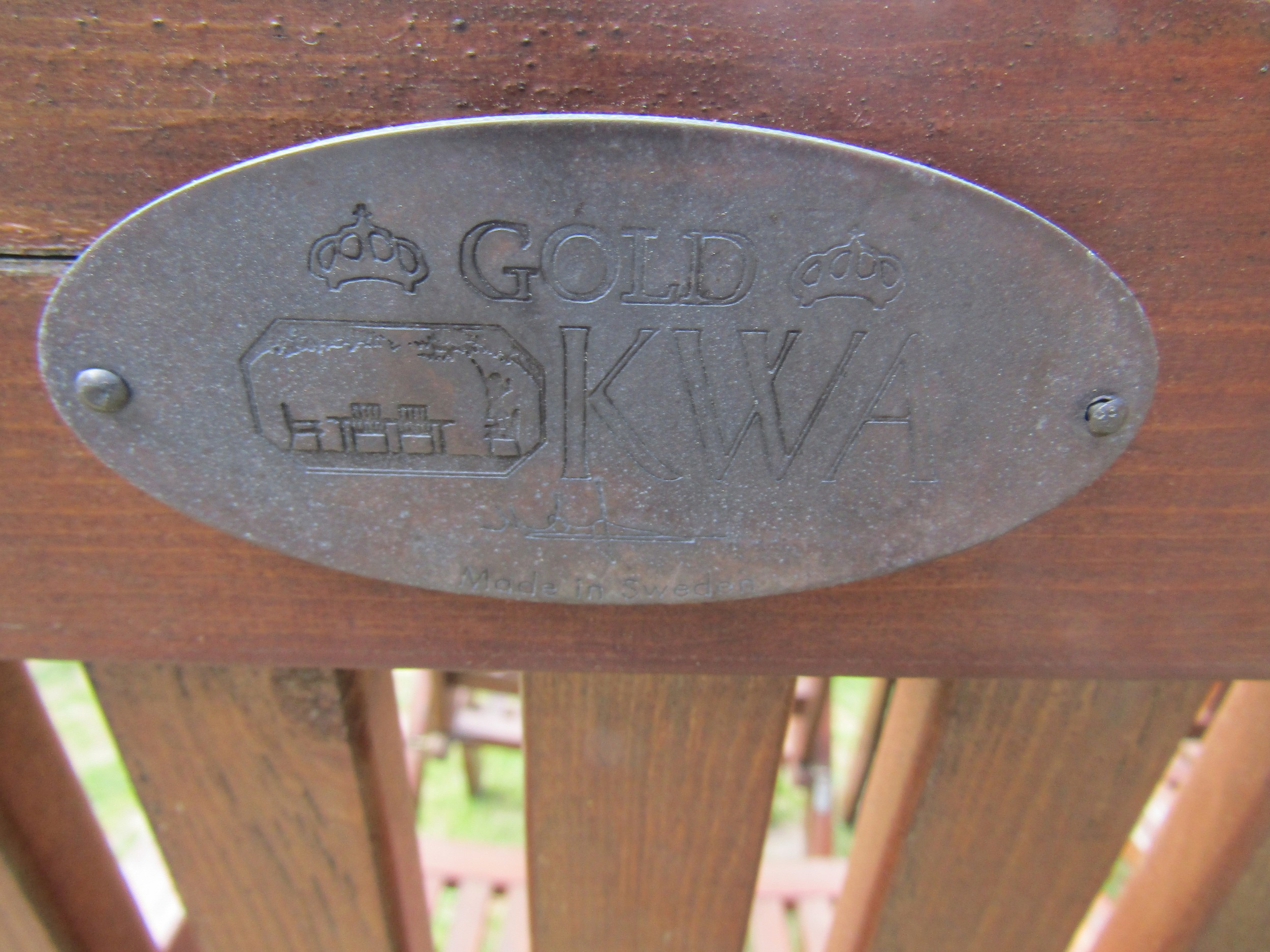 A set of four stained folding softwood garden armchairs with slatted seats and backs, labelled - Image 4 of 5