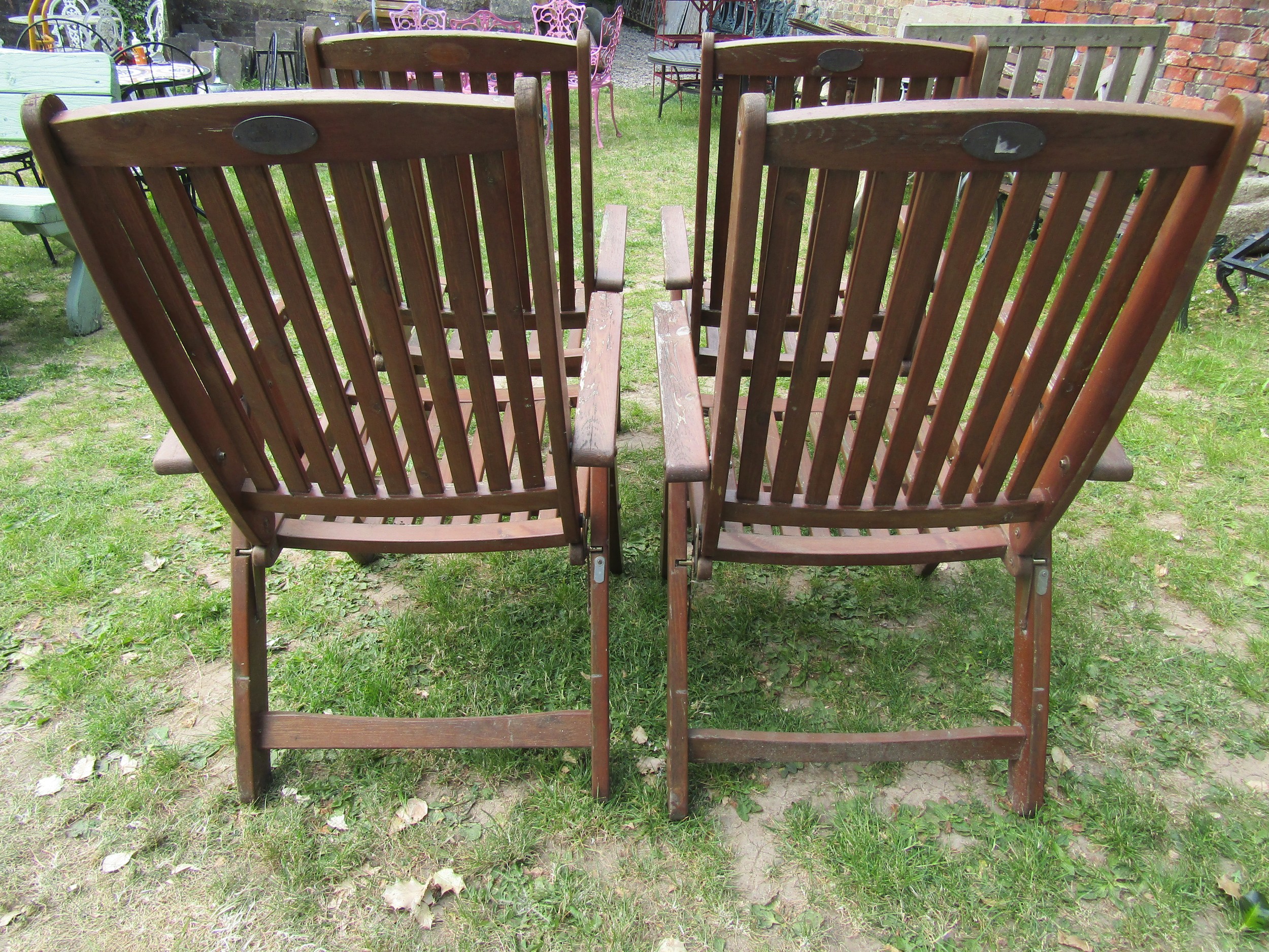 A set of four stained folding softwood garden armchairs with slatted seats and backs, labelled - Image 3 of 5