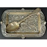 A silver pen tray decorated with green man masks, Birmingham 1902, maker Henry Charles Freeman and a