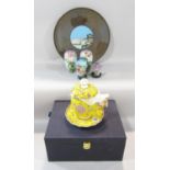 A boxed Chinese yellow and gold floral decorated covered cup and saucer in yellow silk lining, a