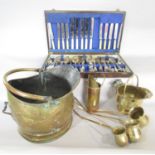 A brass coal bucket, three brass toddy ladles, rum, brandy and whisky, two miniature coal buckets