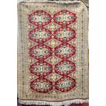 A Bokhara rug, West Turkestan, the madder field with lozenge and cruciform guls, 178cm x 129cm.