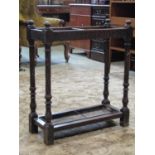 A late Victorian two divisional stick stand with carved supports