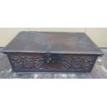 An early 18th century oak bible box, the front elevation with original carved and repeating floral