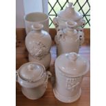 Six creamware crackle glazed jars/vases in various designs, decorated in relief with armorial
