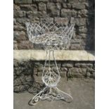 A vintage wirework plant stand raised on scrolled supports, 84 cm high