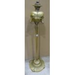 A late 19th century brass oil lamp standard with decorated base