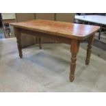 Scrubbed pine kitchen table with heavy plank top, on turned supports, 150cm x 80cm to seat six