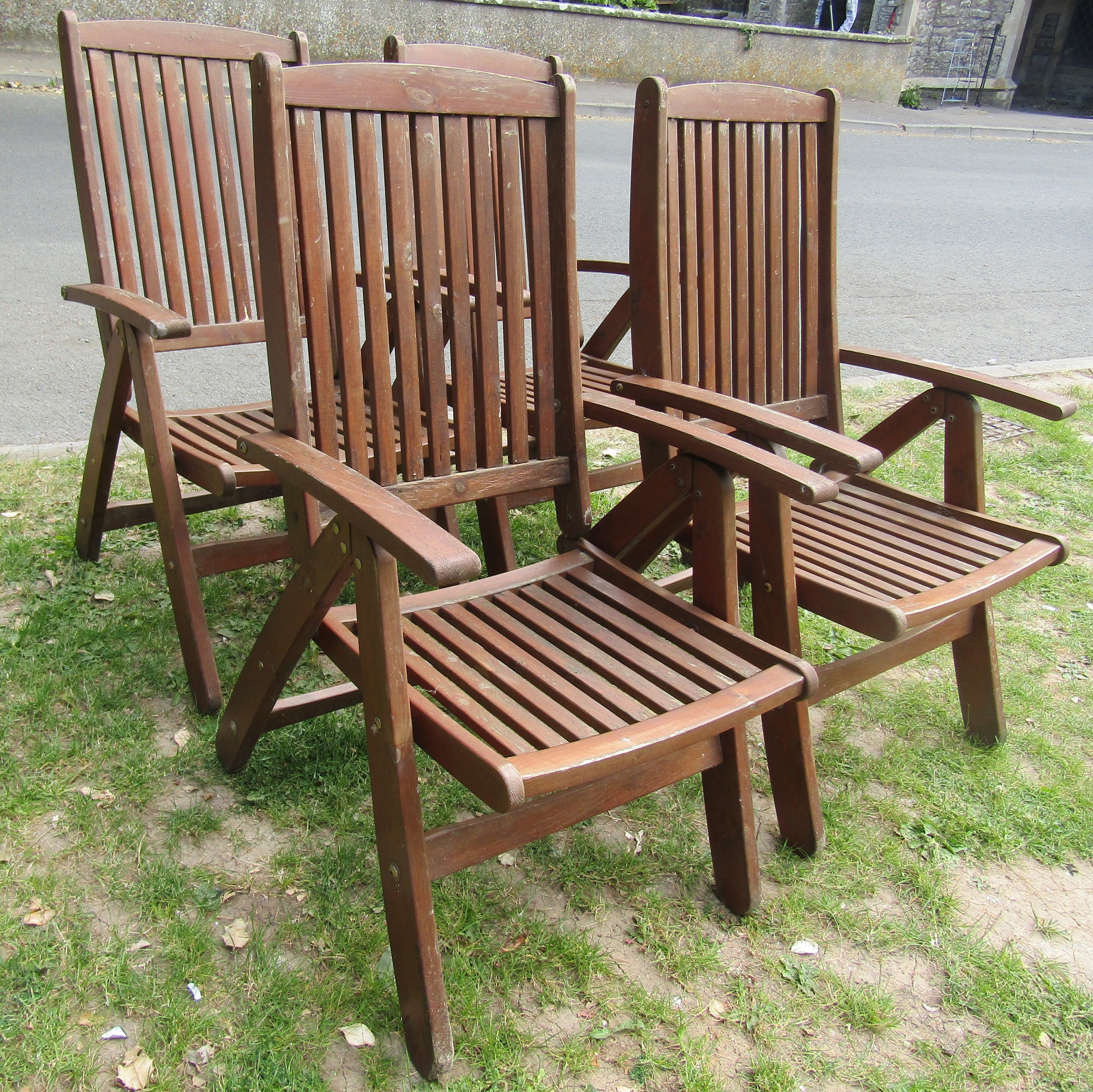 A set of four stained folding softwood garden armchairs with slatted seats and backs, labelled - Image 2 of 5