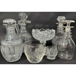 A good selection of 19th and early 20th century cut glass ware, including three decanters, a