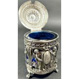 A Dutch mid 19th century silver mustard pot with blue glass liner, decorated with cherubs and
