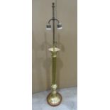 A brass table lamp the circular reeded column supporting a twin bulb fixture, 100cm high