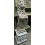 A painted and weathered cast composition stone garden/pier ornament in the form of a lion