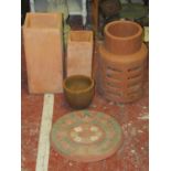 Two square tapered terracotta vases, the largest 18cm square x 38cm high, a further terracotta