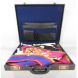 An attaché case containing Masonic regalia, apron, sashes, badges and medals etc.