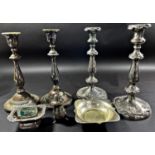 Two pairs of Georgian style silver plated candlesticks, a pair of dishes, two salt cauldrons and a