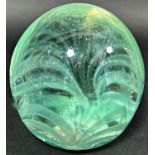 A Victorian pale green glass dump with grass like silvery internal decoration, 9cm high.