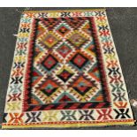 A Chobi Kilim with an all over colourful stepped diamond pattern, 148cm x 102cm approx.