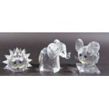 A collection of seven Swarovski crystal animals, marked to the base, and other glass animals along