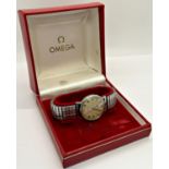 An Omega Geneva gentleman's wristwatch with stainless steel case and fixoflex strap, original red