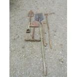 A vintage spade with D shaped wooden handle, one other, a hoe, axe, etc (5) (af) together with a