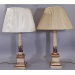 A pair of reproduction Georgian style column lamp in armorial detail on square cut base