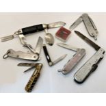 A collection of 23 vintage pen knives, including three military examples each incorporating a marlin