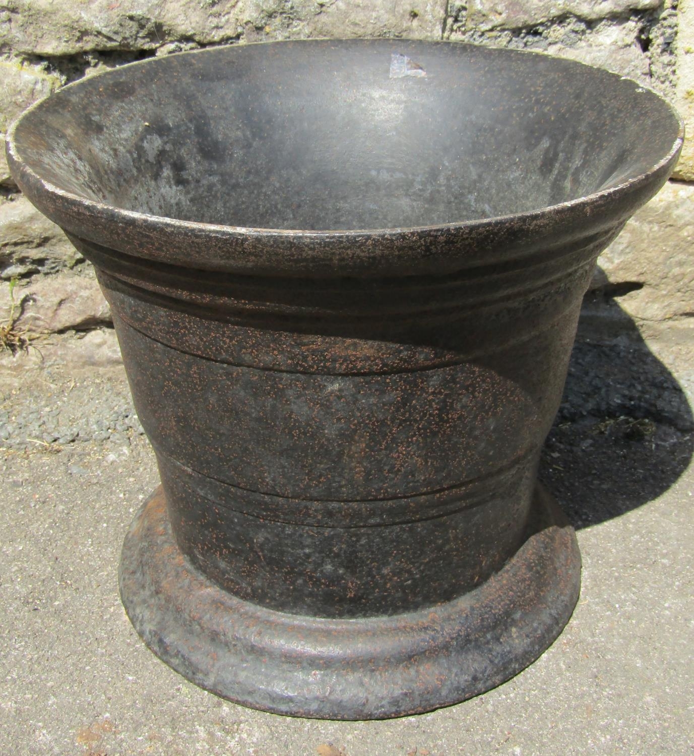 A heavy antique cast iron mortar with flared rim, 35 cm diameter x 29 cm high