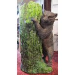 A Bretbyware stick stand modelled as a tree trunk bear cub, naturalistic painted finish