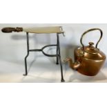 A copper kettle (as found) and a cast iron trivet