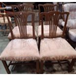 A set of four 19th century mahogany comb back dining chairs, with stuff over seats