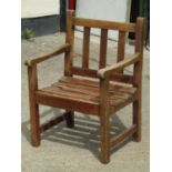 A child's size stained and weathered teak garden open armchair with slatted seat and back, 46 cm