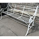 A heavy gage regency style strapwork garden bench with open scrolled arms. 185cm W