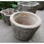 A weathered cast composition stone quatrefoil shaped draped planter 43 cm square approximately x