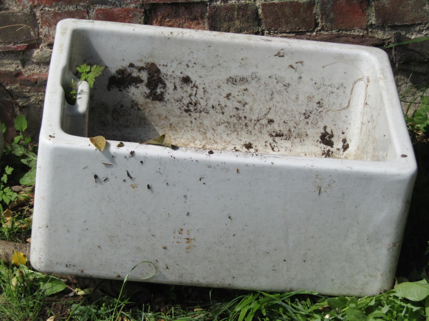 A reclaimed Doulton glazed butlers sink 61 cm long x 46 cm wide x 26 cm high together with a further