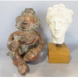A small plaster cast classical bust set of a wooden plinth with a lead seal to the base, 24cm