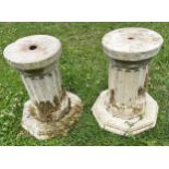 A pair of squat cylindrical fluted pedestals raised on octagonal bases, the top approximately 20