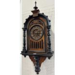 A black forest oak and ebonised cuckoo wall clock presented as a bracket clock, with eight twin