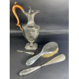 An elegant silver Regency style claret jug with scrolled handle, Chester 1908, maker S