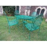 A green painted ironwork five piece garden terrace set comprising a circular top table and four