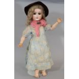 Early 19th century German bisque head doll by Shoenau & Hoffmeister circa 1910 with brown closing