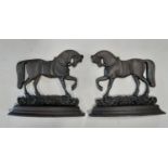 A pair of cast iron novelty prancing horse door porters 25 cm high