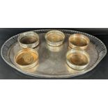 A very large rectangular drinks tray, a large oval tray with a pierced gallery, two further silver