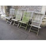 A set of eight (4 + 4) weathered teak folding garden chairs with slatted seats and backs, labelled