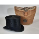 Vintage Christys' of London black silk top hat (with crown vent) and red lined leather hat box.