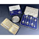 A mixed selection of silver including a boxed set of six teaspoons, a cased pair of trifid spoons,