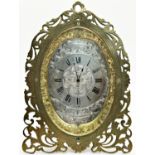 19th century easel clock, the casework with engraved and pierced detail, enclosing an oval