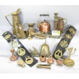 A collection of brass and copperware including a kettle, jugs, five tools, candlesticks, bugles,