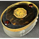 A Coppelia Rose oval crystal dresser box, with later tortoise shell enclosed time piece to the brass
